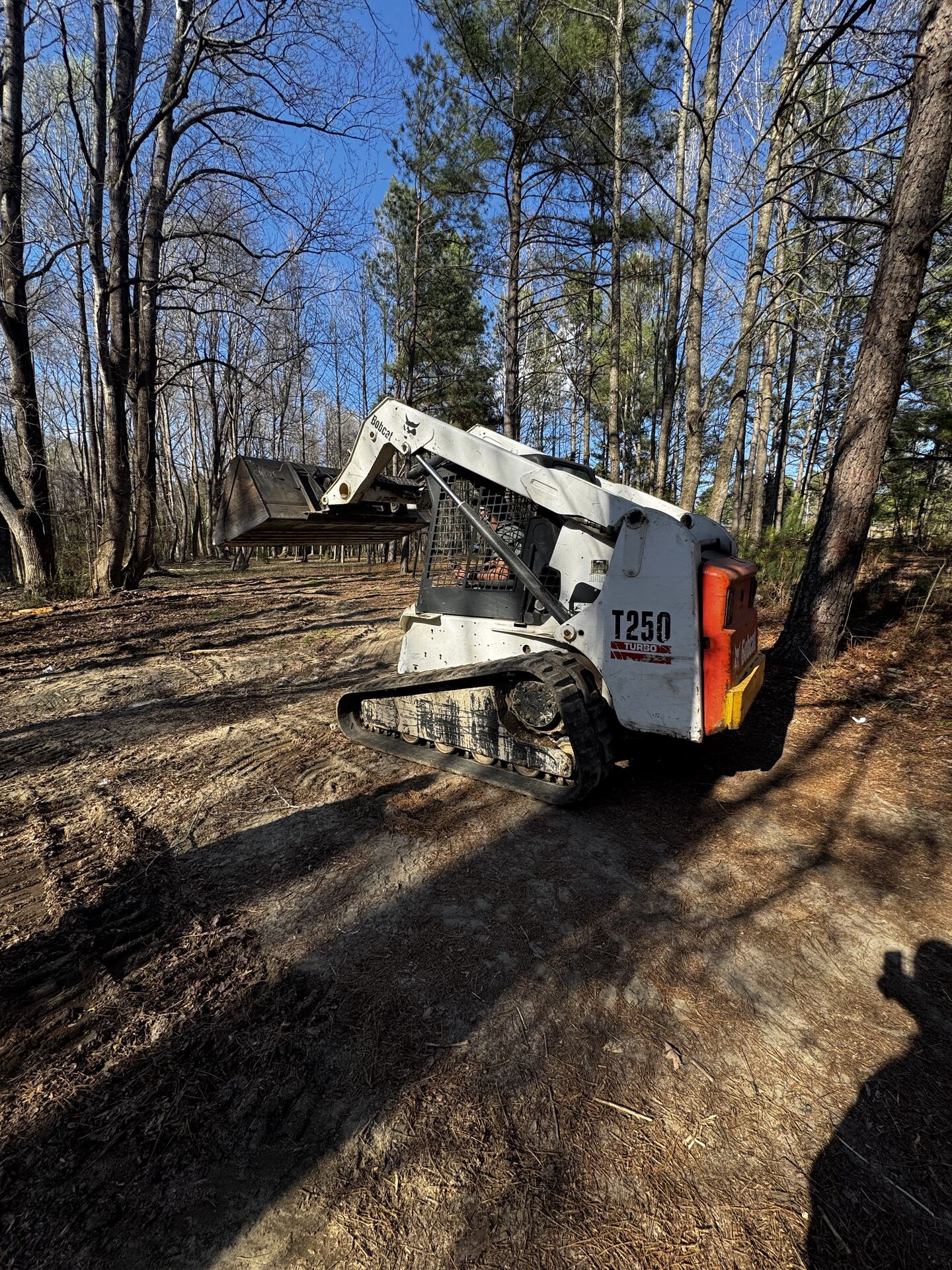 Brush cutter attachment mowing overgrowth